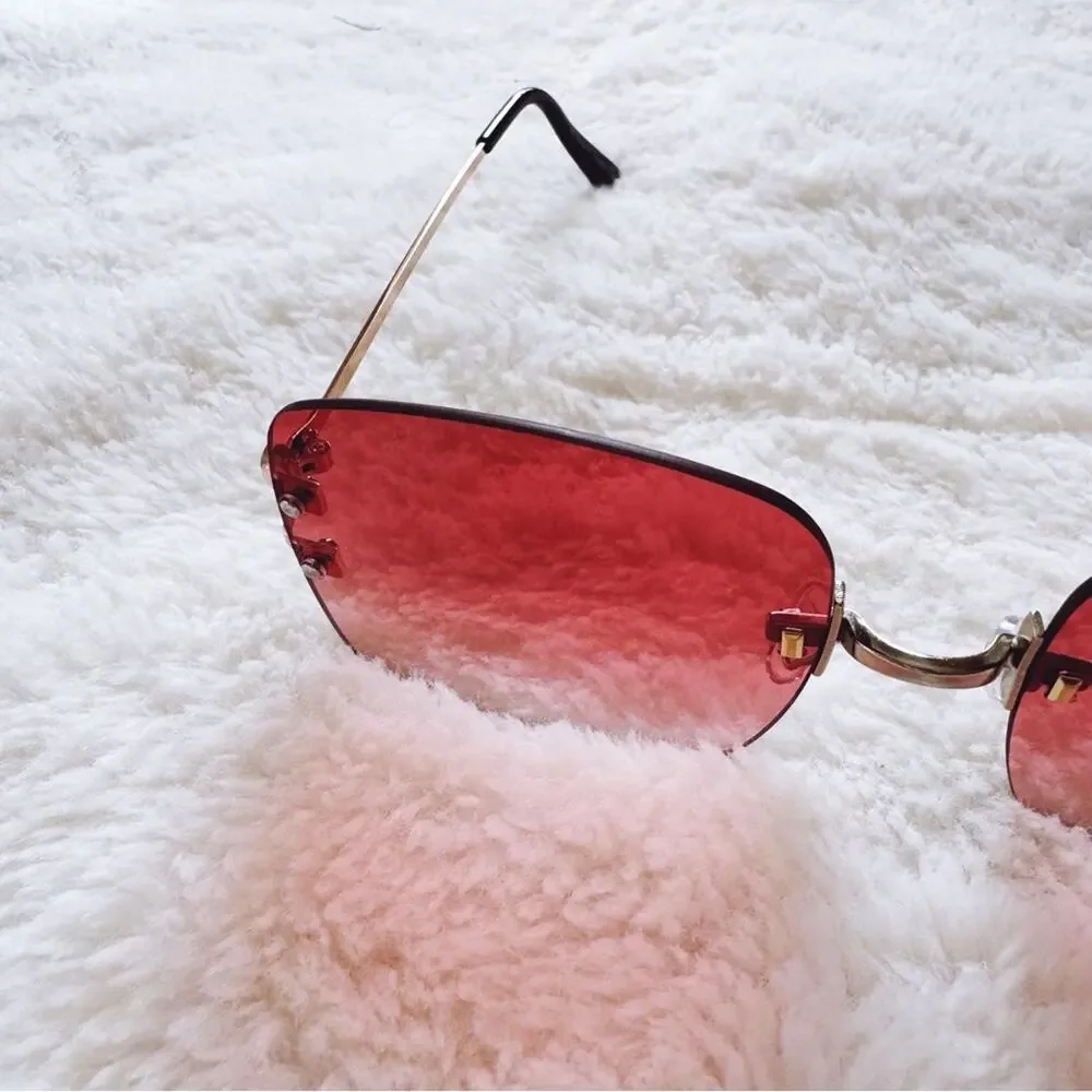 Laurel Clear Orange Rimless Sleek Sunglasses